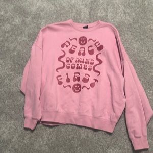Pink sweatshirt.